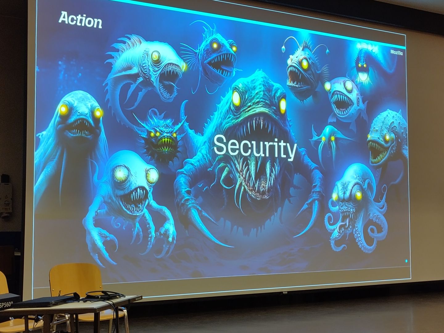 Monsters with glowing eye's an security written in the middle of a slide